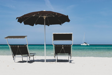 sea and beach umbrella and chaise longue on a white beach - La Cinta, San Teodoro
