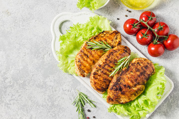 Mexican marinated chicken breasts, grilled with rosemary, vegetables. Top view, space for text.
