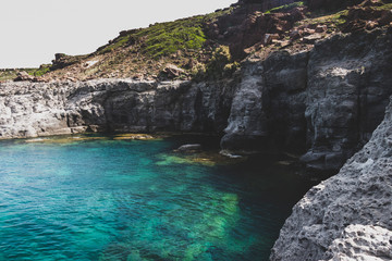 Fototapeta na wymiar cliff and sea water of Sant'Antioco Sardinia