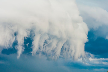 White cumulonimbus clouds against blue sky