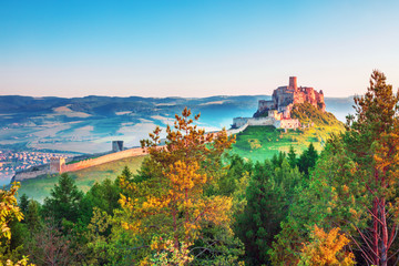 Fototapeta na wymiar Colorful sunrise on Spis Castle, UNESCO heritage in Slovakia