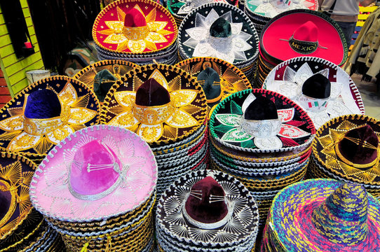 A stack of Sombreros in different sizes for sale in a Mexico City shop.