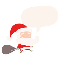 cartoon santa claus carrying sack of presents and speech bubble in retro style