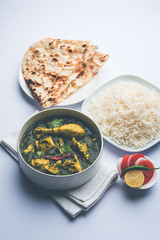 palak/spinach Chicken or Murg Saagwala served in a bowl with Naan and rice