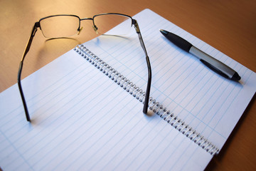 Open White Lined Notebook, Pen and Glasses 4 - obrazy, fototapety, plakaty