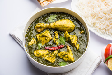 palak/spinach Chicken or Murg Saagwala served in a bowl with Naan and rice