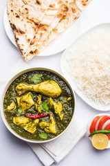 palak/spinach Chicken or Murg Saagwala served in a bowl with Naan and rice