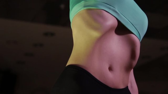 Young woman performs bodyflex exercise.Сlose-up.