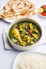 palak/spinach Chicken or Murg Saagwala served in a bowl with Naan and rice
