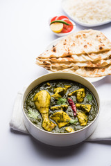 palak/spinach Chicken or Murg Saagwala served in a bowl with Naan and rice