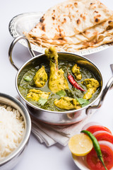 palak/spinach Chicken or Murg Saagwala served in a bowl with Naan and rice