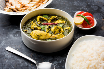 palak/spinach Chicken or Murg Saagwala served in a bowl with Naan and rice