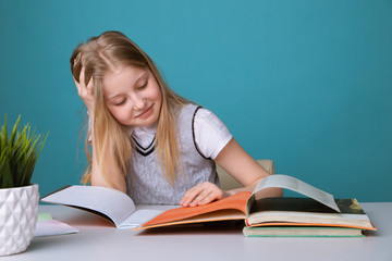 education and school concept - smiling little student girl with many books a