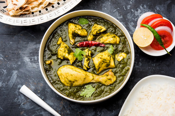 palak/spinach Chicken or Murg Saagwala served in a bowl with Naan and rice