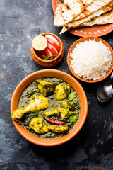 palak/spinach Chicken or Murg Saagwala served in a bowl with Naan and rice