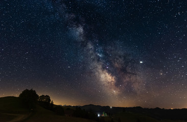 Fototapeta premium milky way above hilly landscape in switzerland