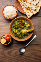 palak/spinach Chicken or Murg Saagwala served in a bowl with Naan and rice