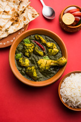 palak/spinach Chicken or Murg Saagwala served in a bowl with Naan and rice