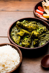 palak/spinach Chicken or Murg Saagwala served in a bowl with Naan and rice