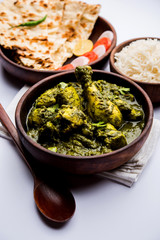 palak/spinach Chicken or Murg Saagwala served in a bowl with Naan and rice