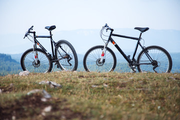 Fototapeta na wymiar Two bicycles on mountain