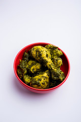 palak/spinach Chicken or Murg Saagwala served in a bowl with Naan and rice