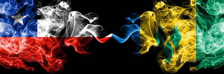 Chile vs Saint Vincent and the Grenadines smoky mystic flags placed side by side. Thick colored...