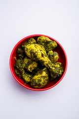 palak/spinach Chicken or Murg Saagwala served in a bowl with Naan and rice