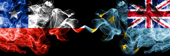 Chile vs Tuvalu, Tuvaluan smoky mystic flags placed side by side. Thick colored silky smokes combination of Tuvalu, Tuvaluan and Chilean flag