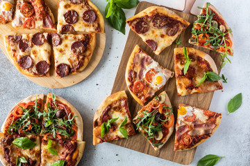 Top view of table with domestic food and homemade pizza. Dinner with friends.