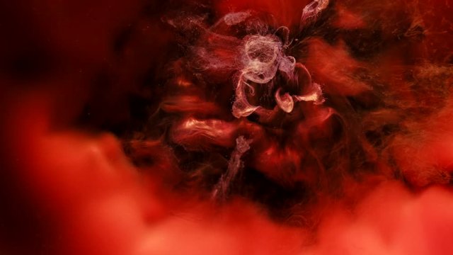 Ink swirling motion. Abstract underwater volcano eruption. Red mixing smoke effect