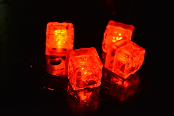 Original bright red glowing plastic cubes in total darkness. Awesome background, hellish and creepy...