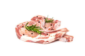 Slice raw pork chop with herb and spices isolated on white background