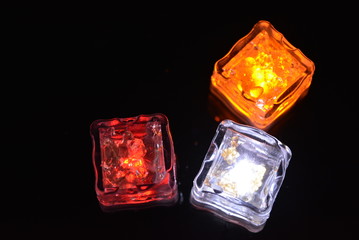 Beautiful plastic ice cubes with bright diode light. Red, yellow, white lighting for parties,...