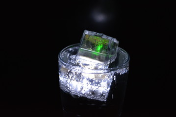 Very beautiful and stunning images of drinks with glowing ice cubes.  Bright colors with bubbles in...