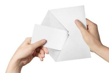 Hands pulling a blank sheet of paper (letter, ticket, flyer, invitation, coupon, banknote, etc.)...