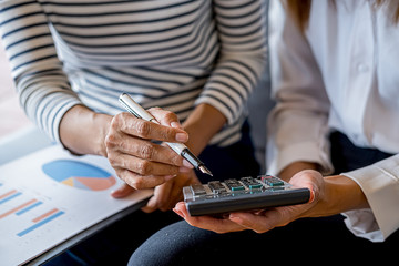 Business team brainstorming and discussing with financial data and report graph. Teamwork meeting working concept.