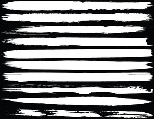 Collection of brush strokes grunge style. Abstract traces from the rollers. White stripes on a black background. Vector abstract elements.