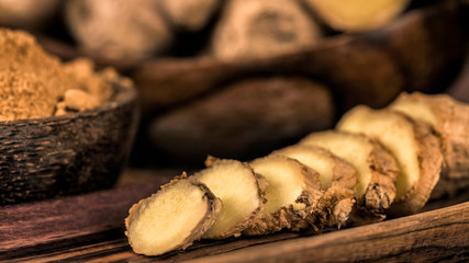 Sliced Ginger Root and Ginger Powder in the Bowl