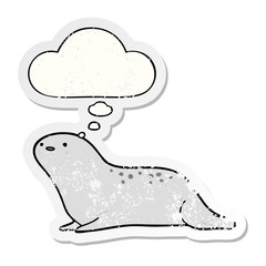 cartoon seal and thought bubble as a distressed worn sticker