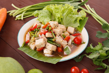 Hot and spicy sour Thai Salads. With white pork sausage and Chopped Mango. Mooyor.