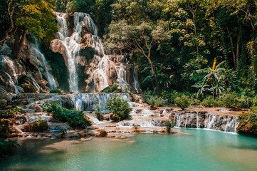 Blue water pond Kuang Si waterfall in Luang Prabang, Laos during summer season.