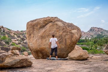 Preparing to climb a boulder