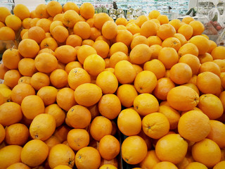 Close Up of many oranges in supermarket, Fruit and food concept