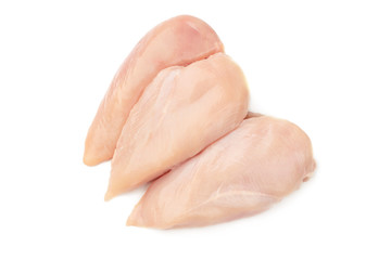Threee fresh raw chicken breasts on white background.
