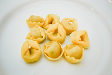 Italian traditional tortellini pasta over white plate. Healthy diet. Mediterranean cuisine.