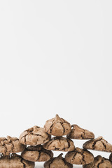 Stacked of homemade dark chocolate cookies isolated on white backdrop