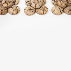 Freshly baked chocolate cookies on white background