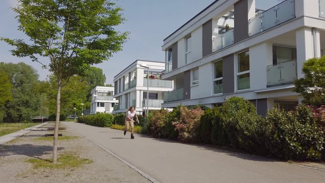 Slow Motion shot of young woman inline skating