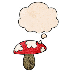 cartoon mushroom and thought bubble in grunge texture pattern style